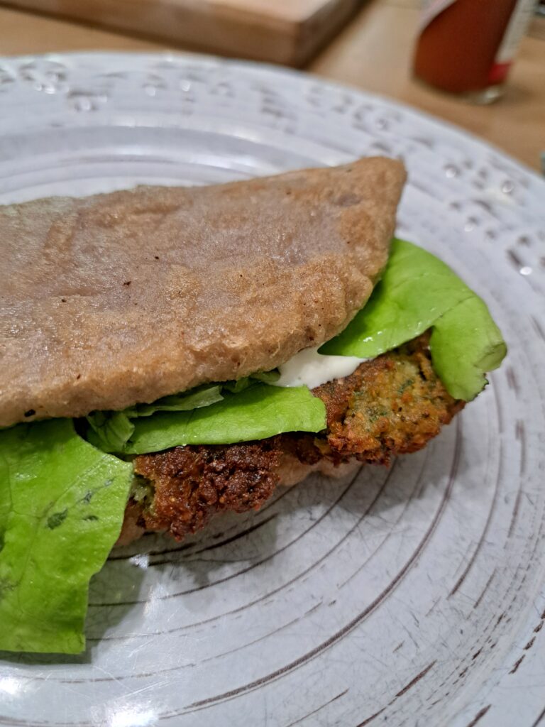 Gluten-free sourdough flatbread falafel sandwich